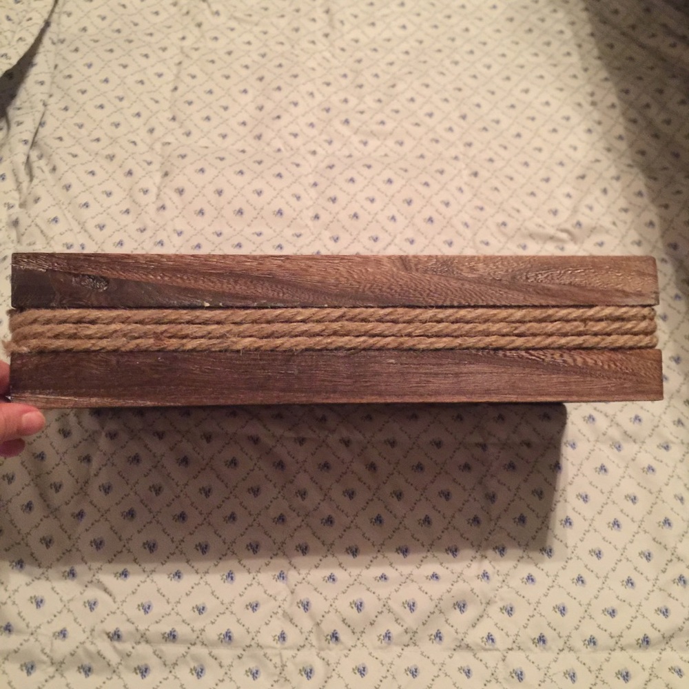 Distressed wooden basket with rope detail